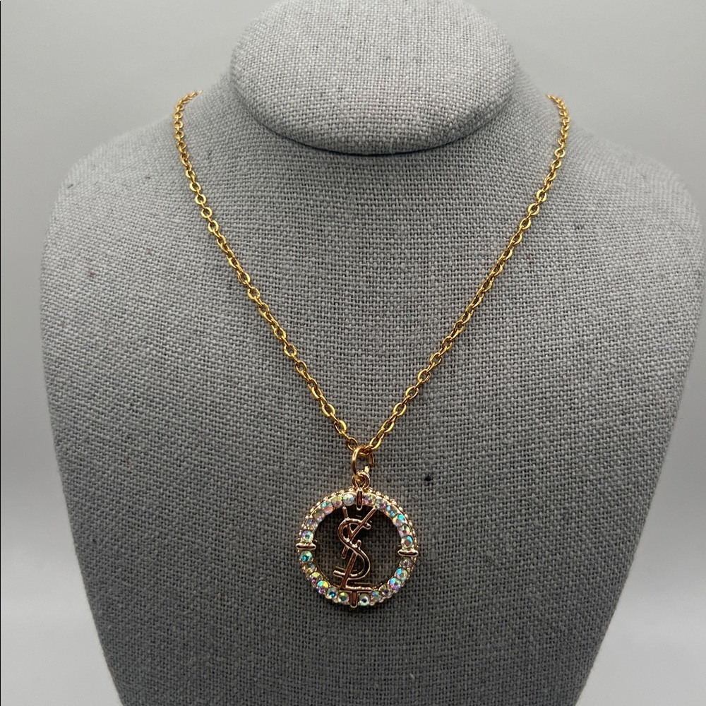 868. Elegant Gold YSL Pendant on 18” gold plated chain. - Picture 2 of 8